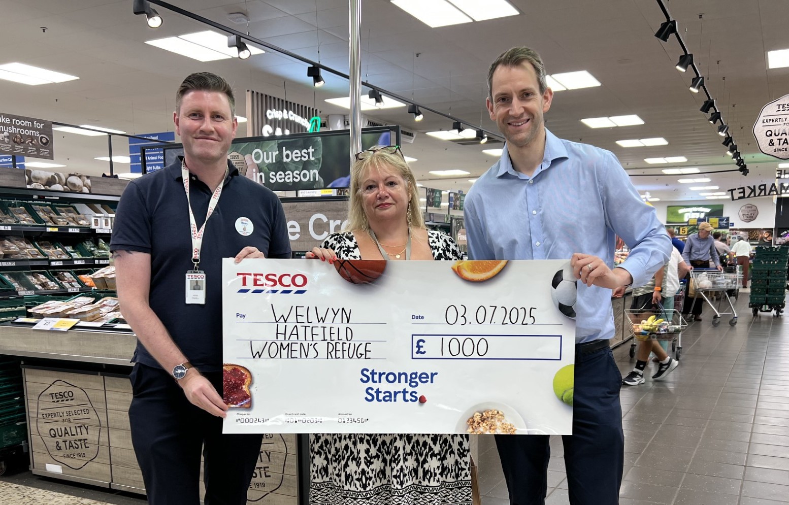 Andrew Lewin, Paula Kerrigan and Ross Powell celebrate the donation and partnership.